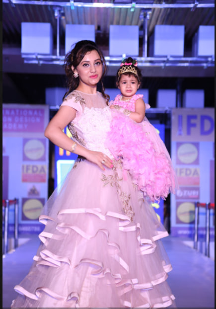 Pink ruffle dress on stage