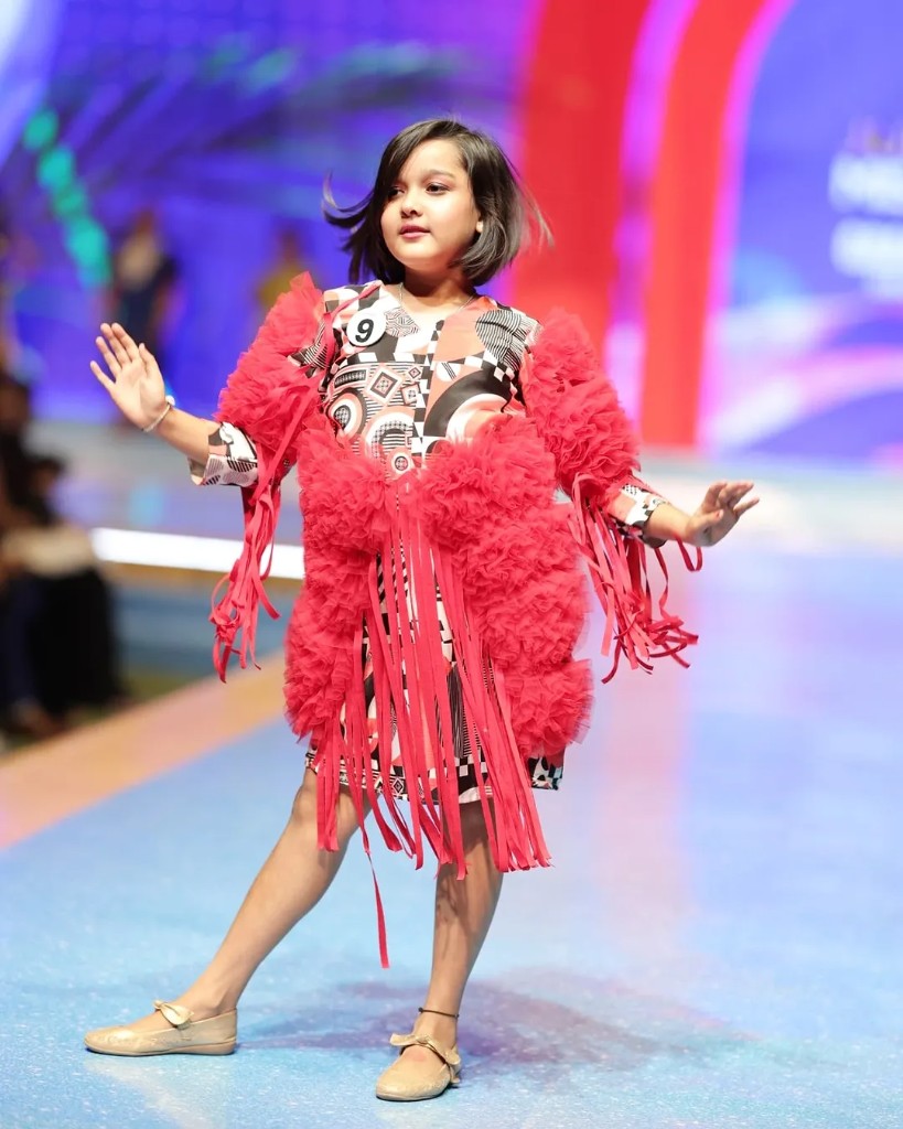 Red fringe dress on runway