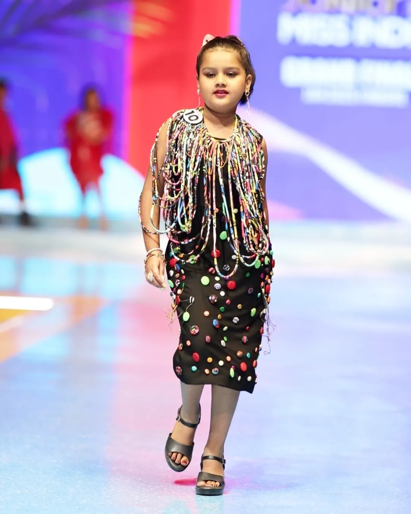 Black embellished dress on runway